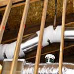 Building with Ducts in Conditioned Spaces
